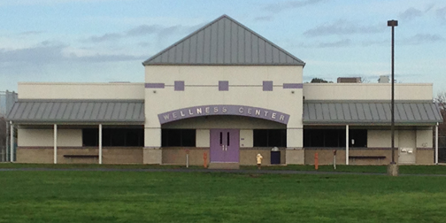 The front of a building that says Wellness Center
